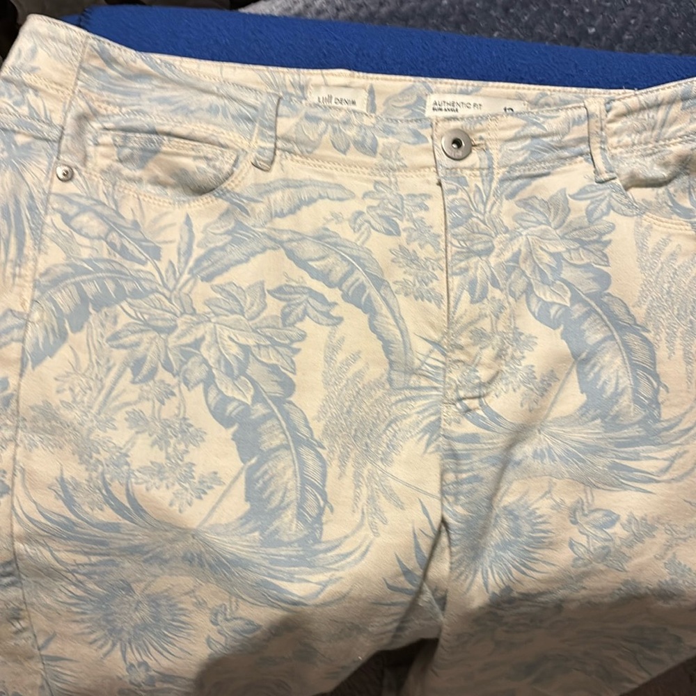 J.Jill denim jeans. White background with light blue floral. Size 12